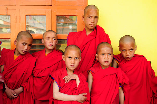 istock Little Tibetan monks standing in front of their classroom 147683787
