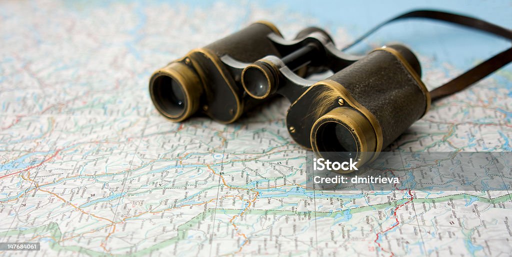 travel binocular on the map Binoculars Stock Photo