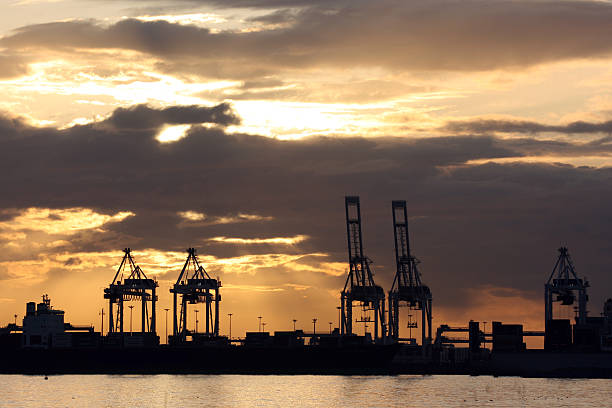istock sunset over industrial ship port 147685407