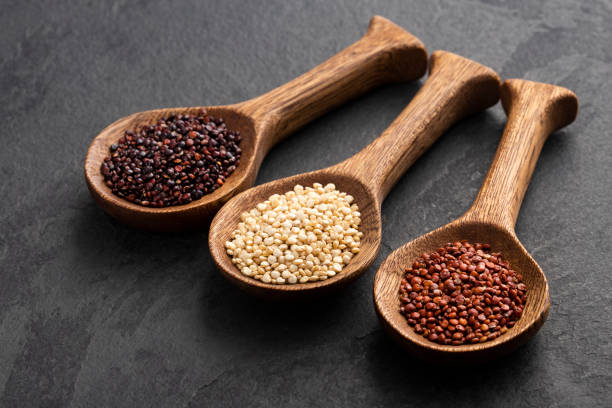 istock White, red and brown quinoa seeds in spoon - Chenopodium quinoa 1476854749