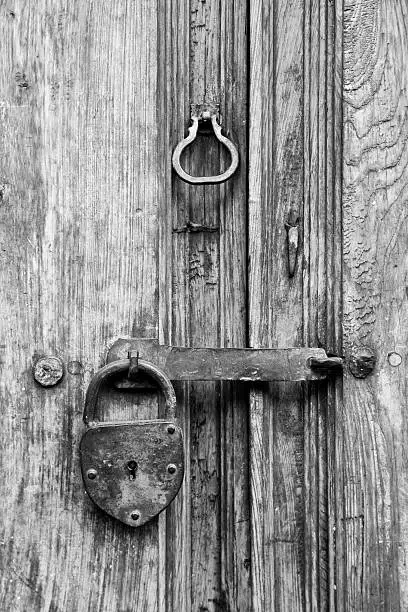 Rustic wooden door and ancient padlock in Mexico