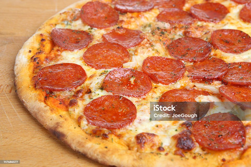 Pepperoni Pizza Extreme close-up of pepperoni pizza __ shallow DoF Pepperoni Pizza Stock Photo