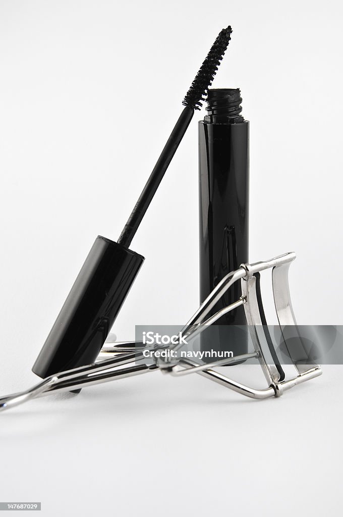 Black mascara and eyelash curler Black mascara and eyelash curler on isolated on white Mascara Stock Photo