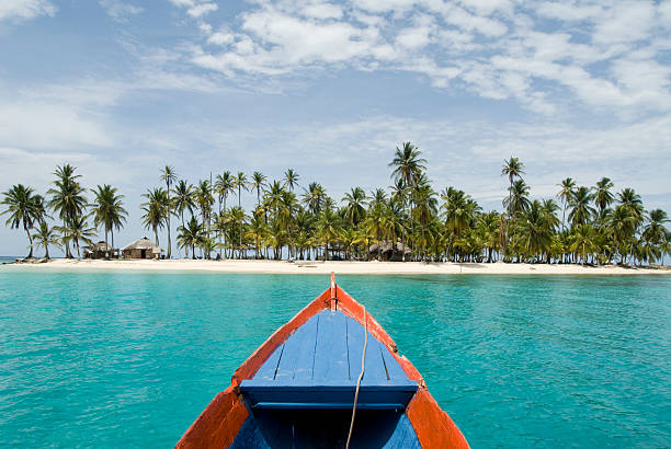 View from boat over cove and the sandy beach of Kuna Ayala Dog Island at Kuna Yala, Panama kuna yala stock pictures, royalty-free photos & images