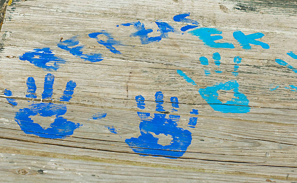 Handprints on Boardwalk stock photo