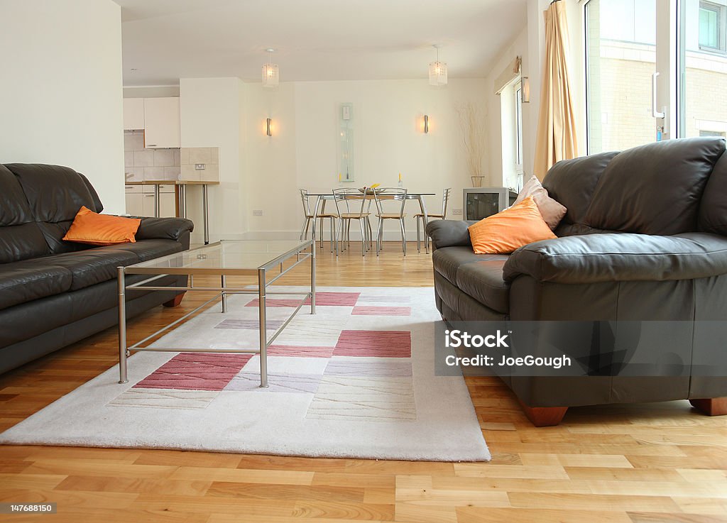 Modern Living Dining Room Luxury modern living-dining room interior with black leather settees Apartment Stock Photo