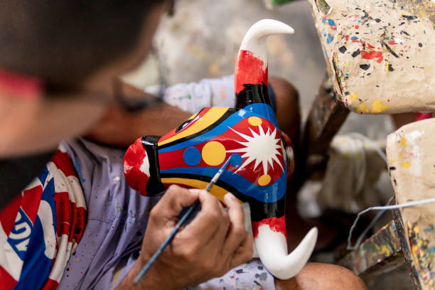 istock man painting bull mask carved 1476882680