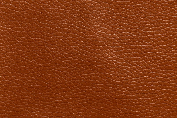 istock Brown leather and a textured background. 1476886469
