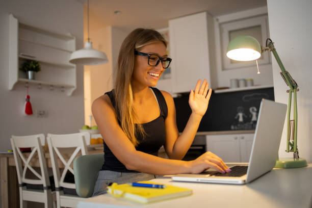 istock Young woman working from home 1476886649