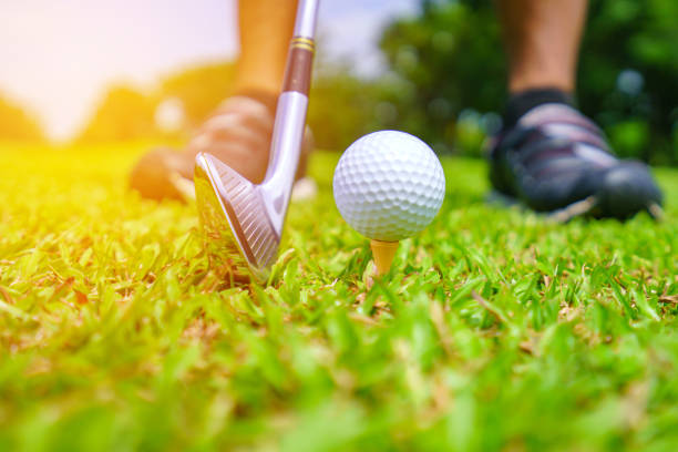 istock Golf ball on green grass ready to be struck on golf course 1476888465