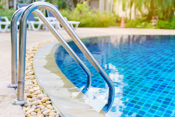 istock blue swimming pool at hotel with stair 1476888466