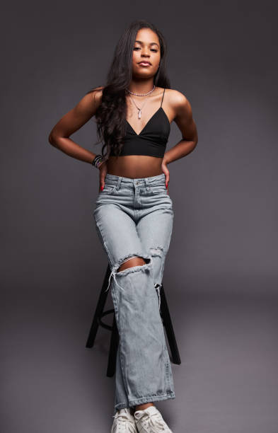 istock Hispanic woman leaning on stool in studio 1476888659