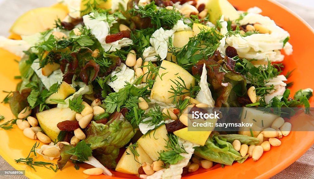 Salad with cabbage, pine nuts, pear and herbs Cabbage Stock Photo