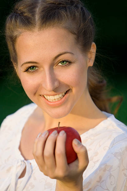 woman with apple stock photo