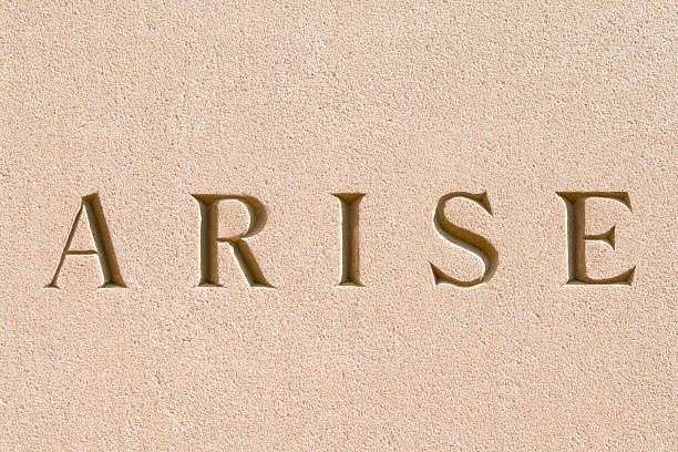 istock Word "Arise" Carved in Sandstone 147689299