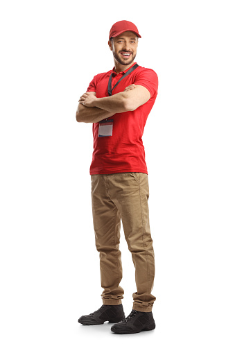Full length shot of a young male sales worker wearing a red t-shirt isolated on white background