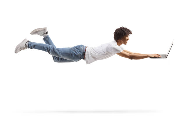 istock African american young man flying and using a laptop computer 1476894746