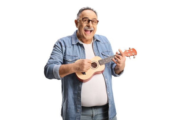 istock Funny mature man playing ukulele 1476894800