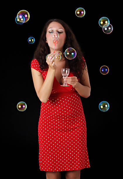 istock woman blowing soap bubble 147689520