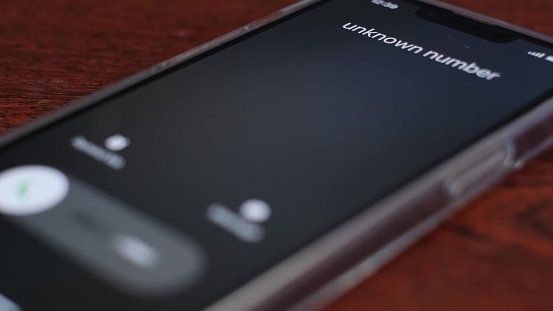 An unknown number is calling the smartphone. Animation of the incoming call screen on a black background. 4k video
