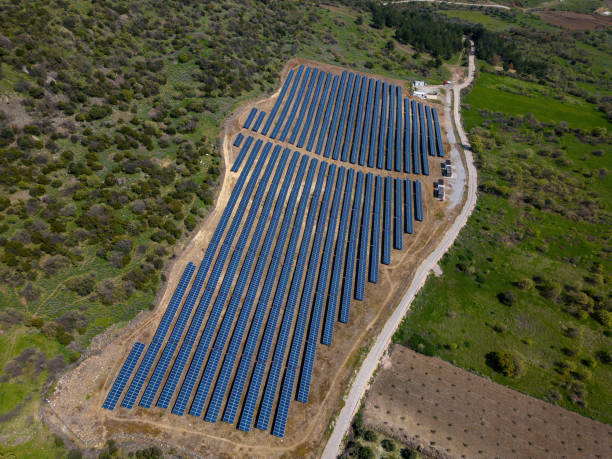 istock Aerial Solar Power Farm. Drone View Blue Photovoltaic Solar Panel Rows. 1476901144