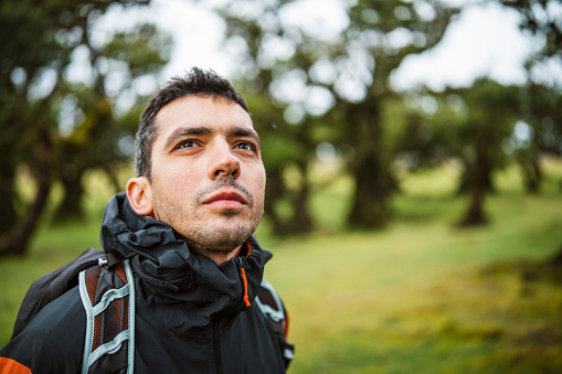 Portrait of middle aged man hiking in the Fanal forest in Madeira,Portugal.