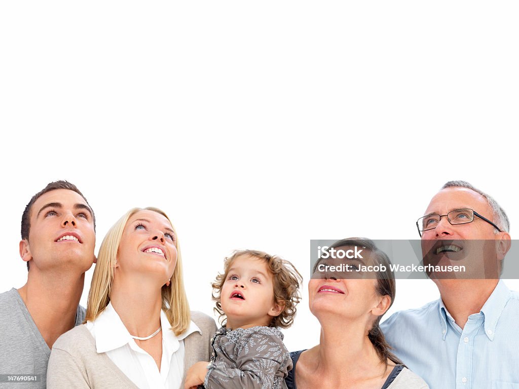 Happy Family Looking Up Against White Background Stock Photo - Download  Image Now - Grandmother, Looking Up, Grandfather - iStock