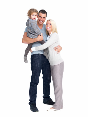 Happy young parents with daughter against white background