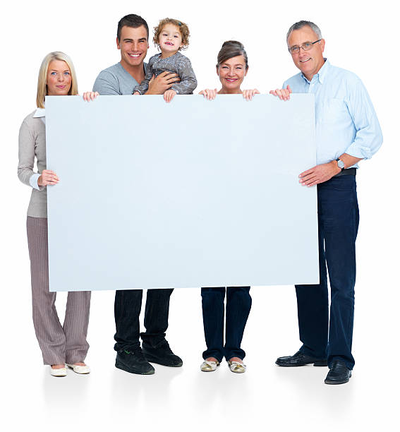istock Happy family holding blank white board 147690660