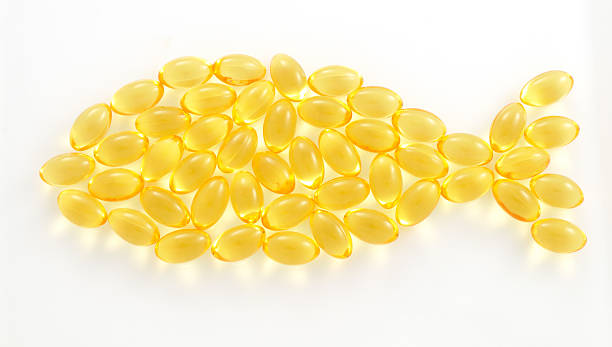 fish shaped tran capsules stock photo