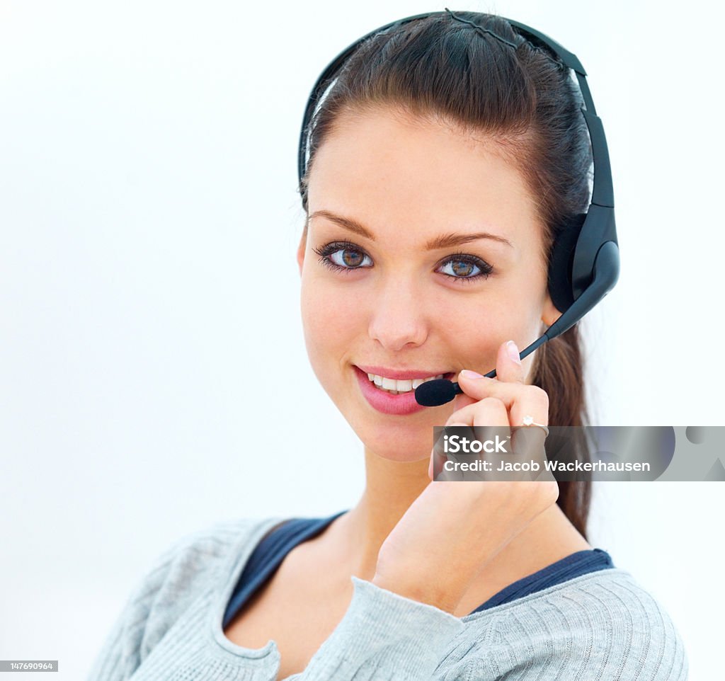 Close-up of happy young woman talking on headset 20-24 Years Stock Photo