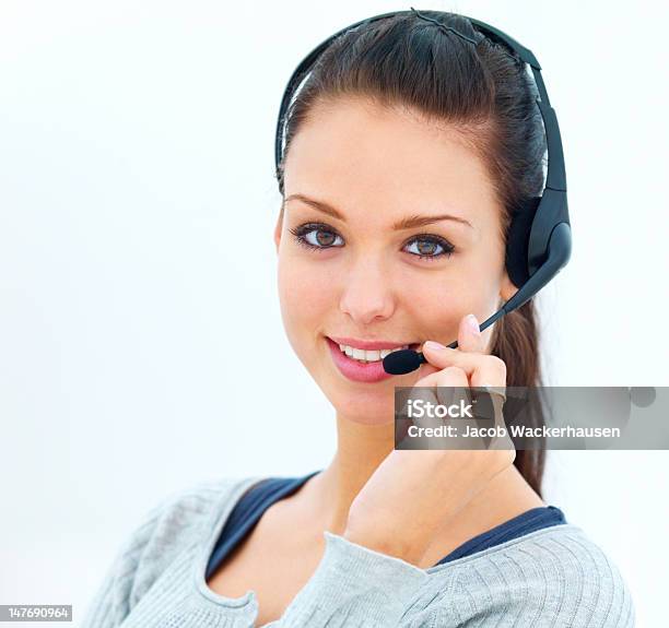 Closeup Of Happy Young Woman Talking On Headset Stock Photo - Download Image Now - 20-24 Years, 20-29 Years, Adult