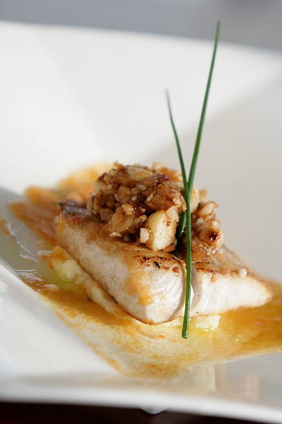 istock White Fish Fillet Garnished with Chives. 147691258