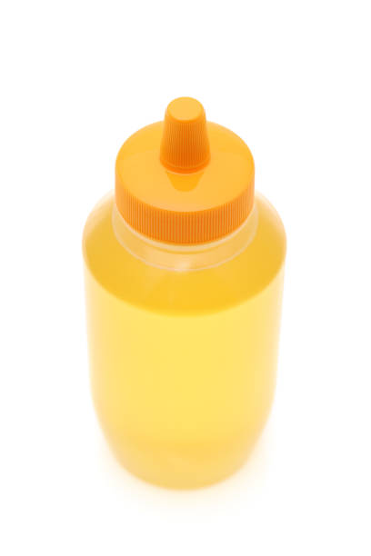 istock Plastic bottle of honey 1476915723
