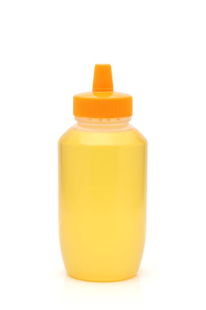 istock Plastic bottle of honey 1476915734