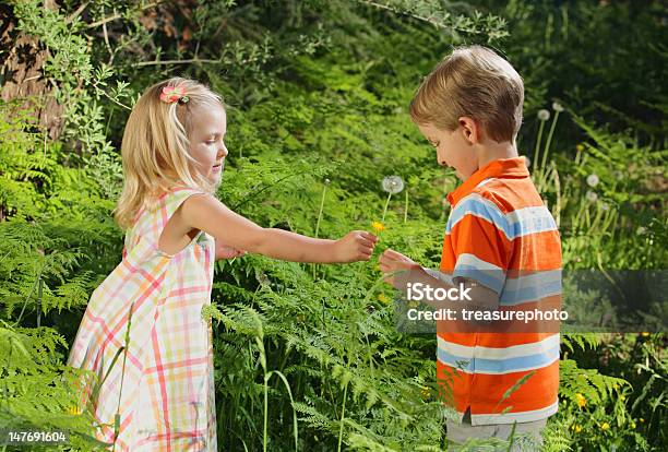 Sharing Stock Photo - Download Image Now - Blond Hair, Bonding, Boys