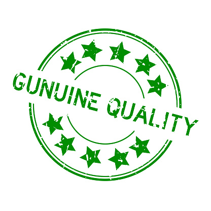 Grunge green genuine quality word with star icon round rubber seal stamp on white background