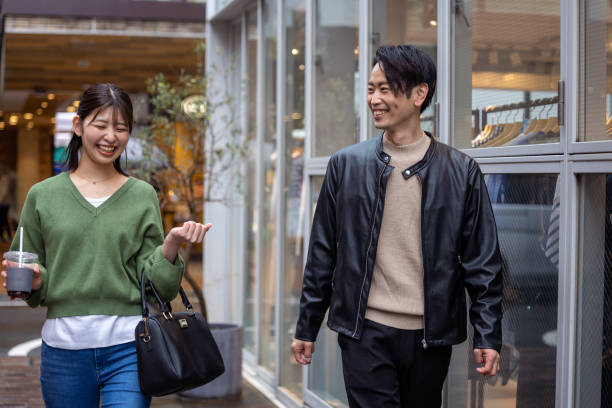 istock Two people talking and shopping in city 1476923232