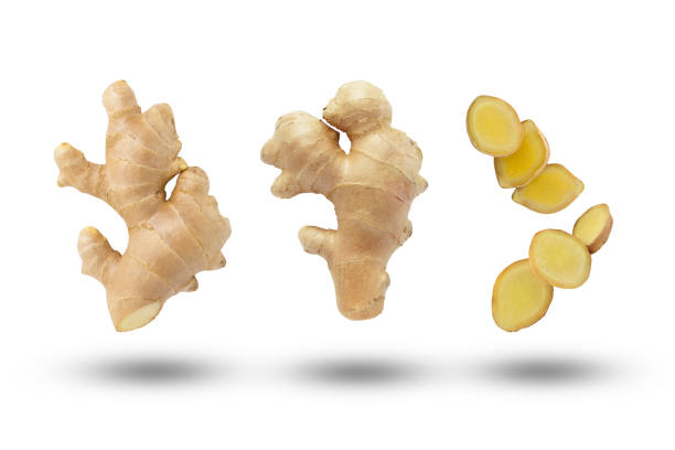 Flying ginger root with slices collection. Flying ginger root with slices collection isolated on white background. ginger stock pictures, royalty-free photos & images