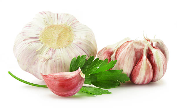 istock Fresh garlic with parsley isolated on white 147693032