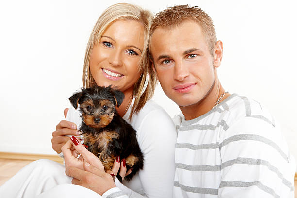 istock Happy couple with a puppy 147693145