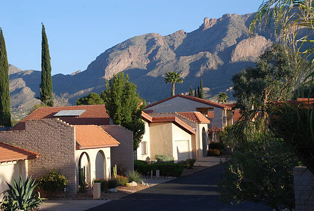 Tucson Mountains An early morning view of the mountains and architecture in Tuscon. adobe material photos stock pictures, royalty-free photos & images