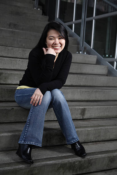 Asian college student on stairs stock photo