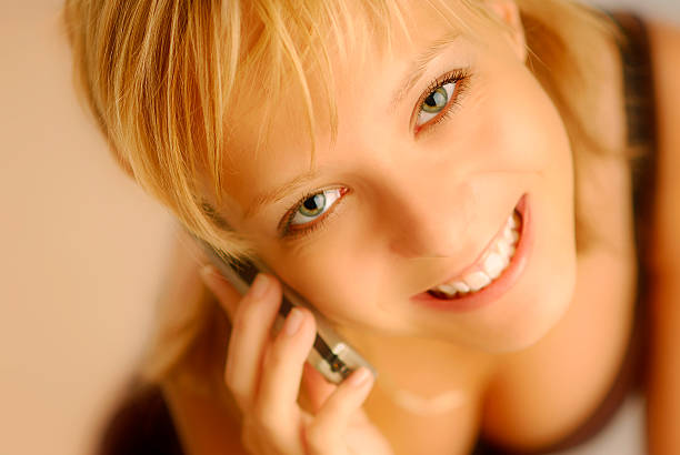 Girl with cellphone stock photo