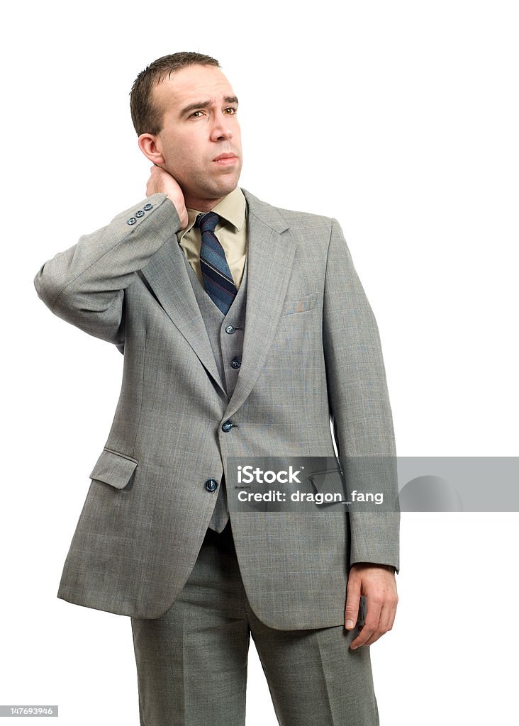 Businessman With Stiff Neck A businessman suffering from a stiff neck, isolated against a white background Adult Stock Photo