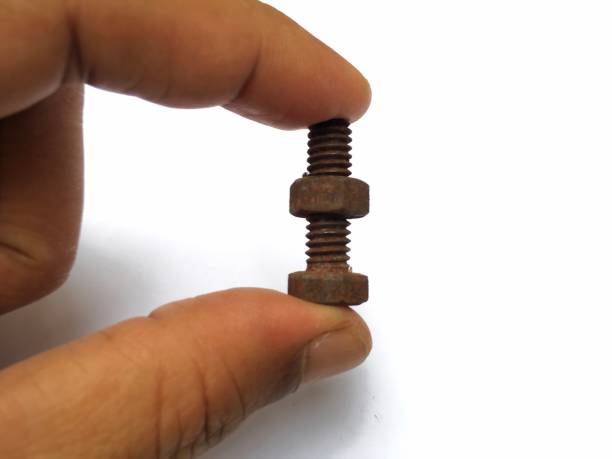 istock holding nuts and bolts 1476946226