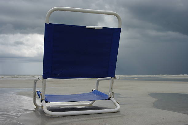 Beach Chair Empty Because of the Storm stock photo