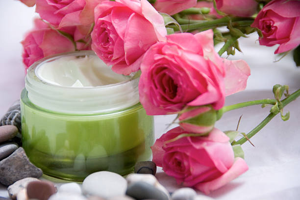 cosmetics creme and roses stock photo