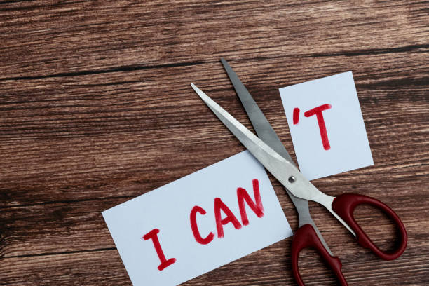 istock Scissor cutting text I can't to can 1476962473