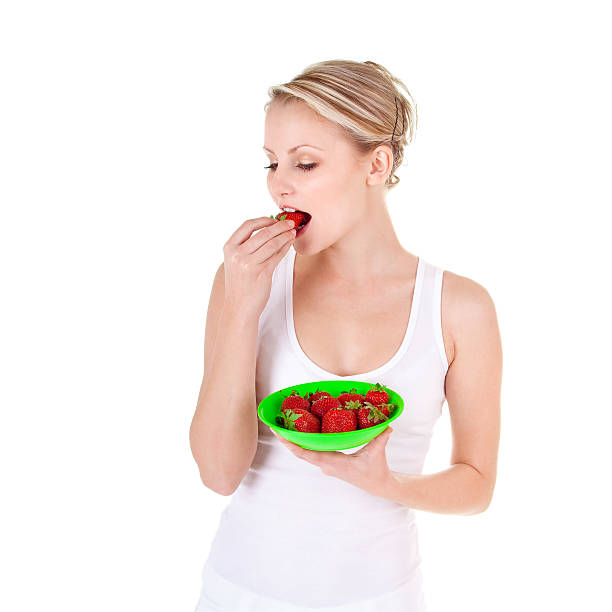 Young woman and strawberry stock photo